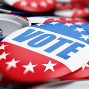 a red, white and blue button that says "vote."