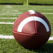 Football on football field.