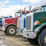 Front end of trucks in a parking lot.
