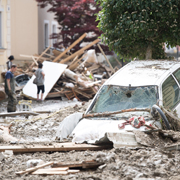 Flood damaged cars and buildings (Photo by Sebastian Widmann/Getty Images)