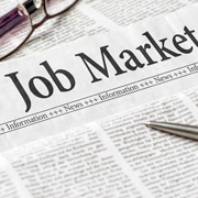 A newspaper with the headline Job Market