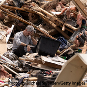 Emotional man sits among wreckage of house after tornado hit London, Kentucky (Michael Swensen/Getty Images)