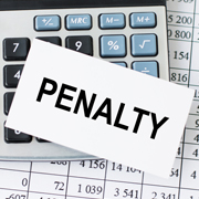 'Penalty' printed in capital letters on a piece of paper on top of a keyboard