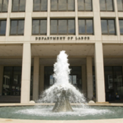 The entrance to the Department of Labor with a fountain in front.