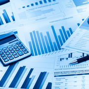 Graphs and calculator on pages signifying earnings reports