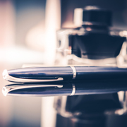 Pen signifying the signing of a reinaurance contract