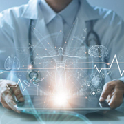 A medical professional wearing a white doctor’s coat and a stethoscope holds a tablet with a bright light and an EKG line across the center, representing a healthcare concept