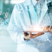 Doctor using a tablet computer overlaid with medical images.