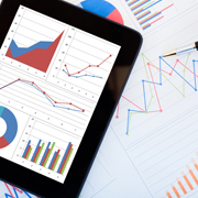 Earnings charts on a computer tablet