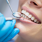 Dentist examining a patient's teeth in the dentist.