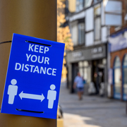 Sign promoting social distancing.