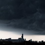 Dark clouds cover most of the sky over Chicago