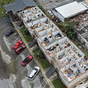 An apartment building open to the sky in Florida after Hurricane Isaias winds tore off the roof (Photo by Joe Raedle/Getty Images)
