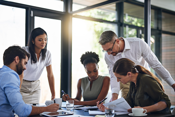 Diverse Team Members Looking at Table