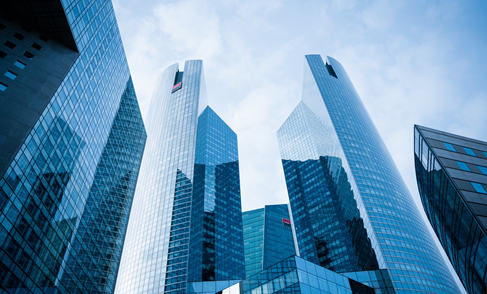 Looking up at blue skyscrapers